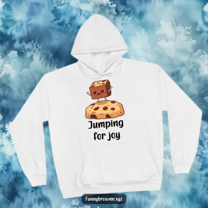 Funny hoodie featuring a square brownie character with legs in mid-air, jumping enthusiastically over a massive cookie crumb for comedic effect.