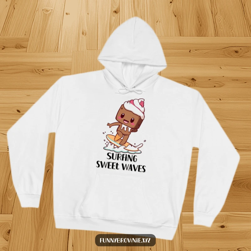 Funny hoodie depicting a brownie character attempting to surf on a melting ice cream cone, perfect for a sweet adventure.